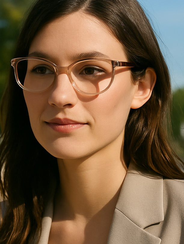 Woman wearing glasses with a blurred natural background